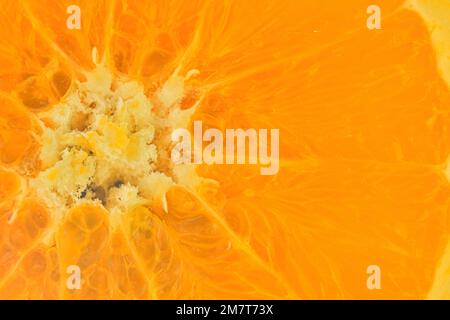 Slice of orange fruit in water on white background. Orange close-up in liquid with bubbles. Slice of red ripe orange in water. Macro image of fruit in Stock Photo