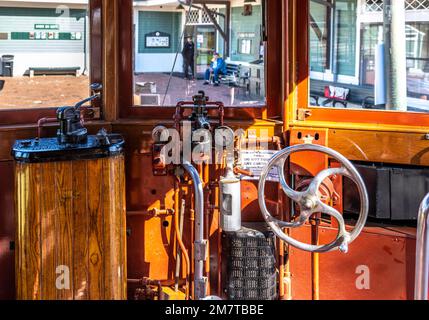 inside No 639 trolley car used to take visitors for a ride at the Seashore Trolley Museum with the vistors center in the distance Stock Photo