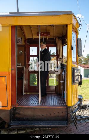 Trolley car conductor waiting for passengers at the Seashore Trolley Museum in Kennebunkport, Maine Stock Photo