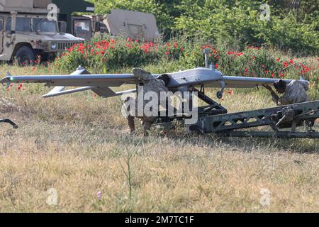 Spc. Ryan Lemon (left) and Spc. Izac Segura, Unmanned Aircraft Systems Repairers assigned to the 7-17th Air Cavalry Squadron, 1st Air Cavalry Brigade conduct pre-flight inspections on a RQ-7B V2 Shadow during Exercise Swift Response on May 13, 2022 at Krivolak Training Area, North Macedonia. The purpose of this exercise is to present combat credible Army forces in Europe and Africa, and enhance readiness by building airborne interoperability with Allies and Partners and the integration of joint service partnership. Stock Photo