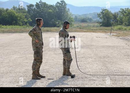 Spc. Ryan Lemon (left) and Spc. Izac Segura, Unmanned Aircraft Systems Repairers assigned to the 7-17th Air Cavalry Squadron, 1st Air Cavalry Brigade await launch instructions a RQ-7B V2 Shadow during Exercise Swift Response on May 13, 2022 at Krivolak Training Area, North Macedonia. Exercise Swift Response 2022 is an annual multinational training exercise, which takes place in Eastern Europe, the Arctic High North, Baltics and Balkans from May 2-22, 2022. Stock Photo