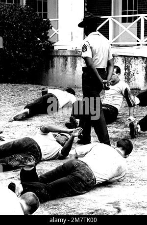 STAFF Sergeant Robert E. Brown, a drill instructor at the Aviation Officer Candidate School, runs his class of candidates through a series of exercises. Base: Naval Air Station, Pensacola State: Florida (FL) Country: United States Of America (USA) Stock Photo