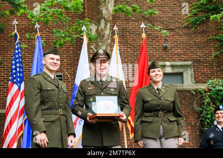 University of Oklahoma’s ROTC cadets presented Brig. Gen. Andrew Preston, commandant, Field Artillery School, with a football after he gave the keynote address during their commissioning ceremony May 13 2022. Stock Photo