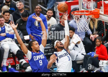 Los Angeles, California, USA. 10th Jan, 2023. Dallas Mavericks guard Jaden Hardy (3) goes to the basket under pressure from Los Angeles Clippers center Moses Brown (9) during an NBA basketball game Sunday, January 10, 2023, in Los Angeles. (Credit Image: © Ringo Chiu/ZUMA Press Wire) EDITORIAL USAGE ONLY! Not for Commercial USAGE! Stock Photo