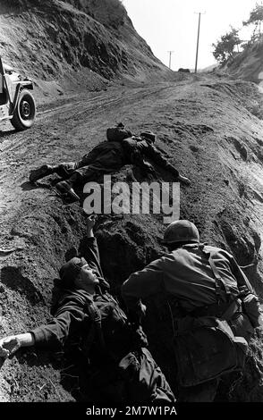 Members of Company C, 1ST Battalion, 35th Infantry, 25th Infantry Division, capture enemy soliders during the joint US/South Korean training Exercise TEAM SPIRIT '82. Subject Operation/Series: TEAM SPIRIT '82 Base: Geon Cha Country: Republic Of Korea (KOR) Stock Photo