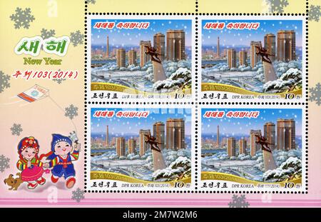 2014 North Korea stamp. New Year. Changjon street seen from Moran Hill at Winter Stock Photo