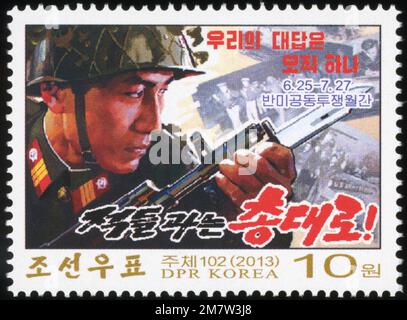 2013 North Korea stamp set. Month of Fight Against USA. There is only one answer for us, guns against the enemy! Stock Photo