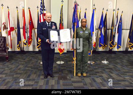 Georgia Air National Guard Commander, Maj. Gen. Thomas Grabowski and Ga. ANG State Command Chief, Chief Master Sergeant Lynda Washington, pose for a photo to highlight the Air Force Organizational Excellence Award certificate May 14, 2022 during a special ceremony at the Clay National Guard Center in Marietta, Ga.  The Department of the Air Force awarded the organization for exceptionally meritorious service between the years 2019-20. Stock Photo