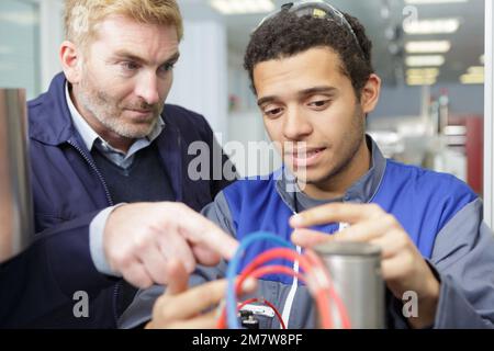 young student of mechatronics working on project Stock Photo