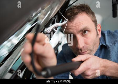 concentrated man pumping wheel bike Stock Photo