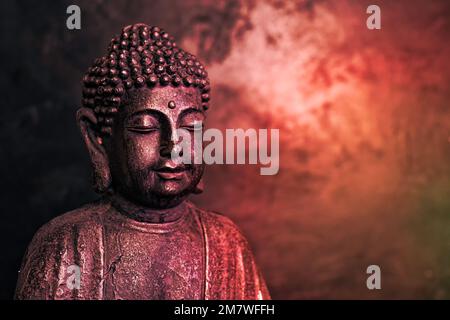 Meditating Buddha Statue on dark background. Soft focus. Close up. Copy ...