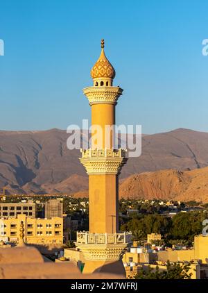 Minaret of Al Qala'a mosque as seen from Nizwa Fort, Oman Stock Photo