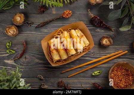 Asian style food concept. Fried spring rolls with vegetables, top view Stock Photo