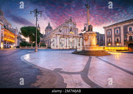 Catania, Sicily, Italy. Cityscape image of Duomo Square in Catania, Sicily with Cathedral of Saint Agatha at sunrise. Stock Photo