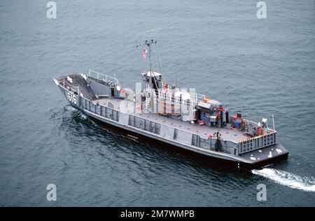 An aerial port quarter view of a utility landing craft (LCU-1616) attached to Assault Craft Unit One (ACU-1) during a practice landing at the Silver Strand area of North Island. Base: San Diego State: California (CA) Country: United States Of America (USA) Stock Photo