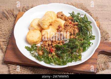 deep fried egg tofu with minced pork in sweet and sour gravy sauce on ...