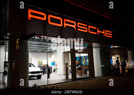 Yokohama, Kanagawa, Japan. 5th Nov, 2022. A Porsche luxury car dealership in Yokohama.Porsche AG is a German luxury automotive manufacturer founded in 1931 and headquartered in Stuttgart, Germany. Known for its high-performance sports cars and SUVs, Porsche is a subsidiary of Volkswagen AG. The current CEO is Oliver Blume and Porsche Automobil Holding SE is the majority stakeholder of Porsche AG. The Porsche and PiÃ«ch families together own a majority of the voting shares in Porsche Automobil Holding SE.Minato Mirai 21 (ã¿ãªã¨ã¿ã‚‰ã„21) is a large urban development located in Yokoh Stock Photo