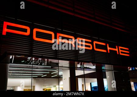 Yokohama, Kanagawa, Japan. 5th Nov, 2022. A Porsche luxury car dealership in Yokohama.Porsche AG is a German luxury automotive manufacturer founded in 1931 and headquartered in Stuttgart, Germany. Known for its high-performance sports cars and SUVs, Porsche is a subsidiary of Volkswagen AG. The current CEO is Oliver Blume and Porsche Automobil Holding SE is the majority stakeholder of Porsche AG. The Porsche and PiÃ«ch families together own a majority of the voting shares in Porsche Automobil Holding SE.Minato Mirai 21 (ã¿ãªã¨ã¿ã‚‰ã„21) is a large urban development located in Yokoh Stock Photo