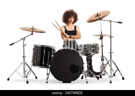 Female drummer sitting and holding drumsticks isolated on white background Stock Photo