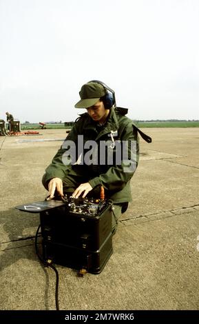 SSGT Paul Geringer operates an AN/APM-378 IFF test set which sends out impulses that test the friend/foe transponder on an F-4D Phantom II aircraft, during Exercise Coronet Brave. Subject Operation/Series: CORONET BRAVE Base: Raf Finningley Country: England / Great Britain (ENG) Stock Photo
