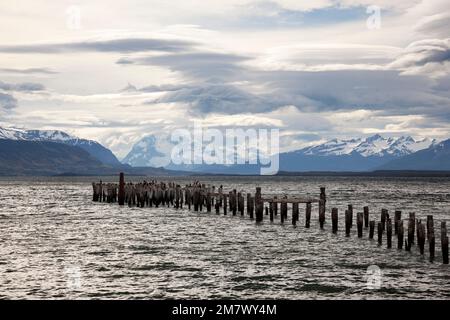 The remains of an old pier, now a resting place for seabirds. Puerto Natales, Chilean Patagonia. Stock Photo