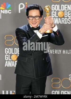 Ke Huy Quan poses in the press room with the award for best supporting ...