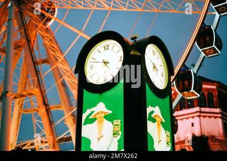 Big clock near Ferris wheel in the Dusseldorf city. Stock Photo