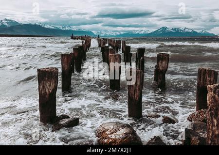 The remains of an old pier, now a resting place for seabirds. Puerto Natales, Chilean Patagonia. Stock Photo