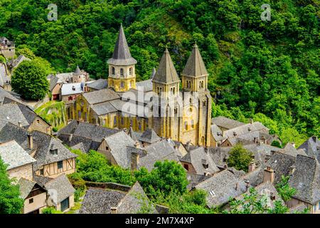 Elevated view of Conques village and abbey-church of Sainte-Foy the jewel of Romanesque architecture, Occitanie, France. Stock Photo