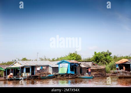 Chong Kneas, Cambodia-August 6, 2009: In a village of houseboats near Siem Reap, people doing housework Stock Photo