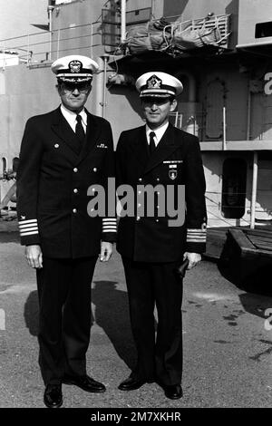 A US Navy officer and the Turkish Naval Attache to the United States, right, pose together during the combined decommissioning and transfer ceremony for the destroyer USS ORLECK (DD 886). After decommissioning, the ship will be transferred to the Turkish Navy and renamed the TCG YUCETEPE (D-345). Base: Tacoma State: Washington (WA) Country: United States Of America (USA) Stock Photo