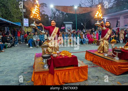 Pokhara, Nepal - December 2nd, 2022 - Hindu  Monks chanting sacred mantras to bless people and offering goods to deiity Stock Photo