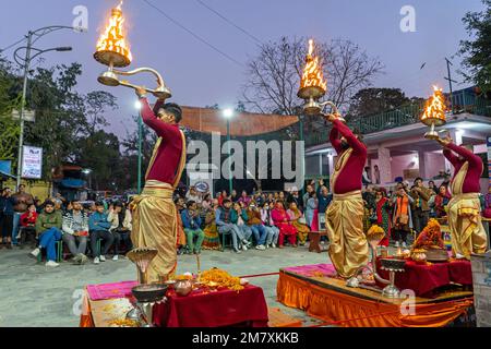 Pokhara, Nepal - December 2nd, 2022 - Hindu  Monks chanting sacred mantras to bless people and offering goods to deiity Stock Photo