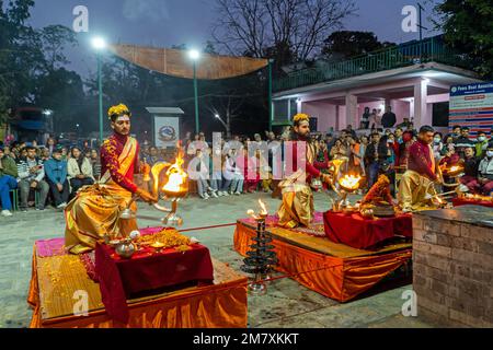 Pokhara, Nepal - December 2nd, 2022 - Hindu  Monks chanting sacred mantras to bless people and offering goods to deiity Stock Photo