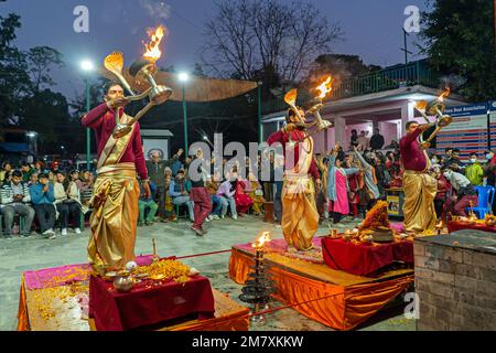 Pokhara, Nepal - December 2nd, 2022 - Hindu  Monks chanting sacred mantras to bless people and offering goods to deiity Stock Photo