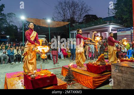 Pokhara, Nepal - December 2nd, 2022 - Hindu  Monks chanting sacred mantras to bless people and offering goods to deiity Stock Photo