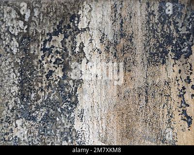 Close-up of metal surface with peeling gray paint as background Stock Photo