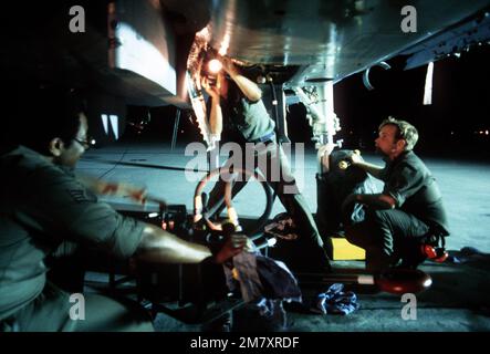 A nighttime view of a maintenance crew servicing an F-15 Eagle aircraft from the 33rd Tactical Fighter Wing during the air-to-air combat training exercise William Tell '82. Subject Operation/Series: WILLIAM TELL '82 Base: Tyndall Air Force Base State: Florida (FL) Country: United States Of America (USA) Stock Photo