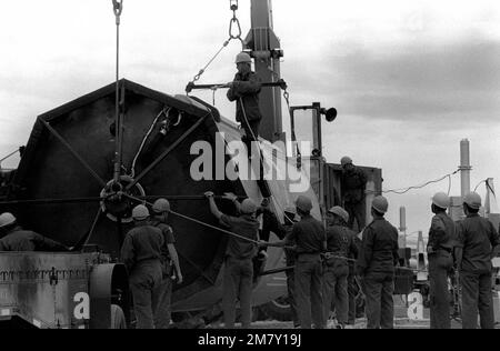 Members of the 390th Missile Maintenance Squadron prepare stage one of a Titan II intercontinental ballistic missile (ICBM) for transport from site 571-6 to Davis-Monthan Air Force Base, Arizona. Country: Unknown Stock Photo