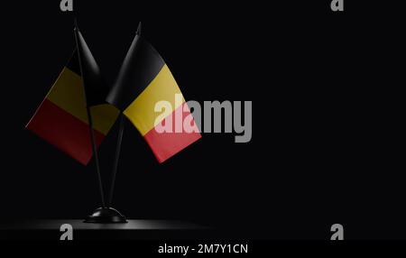 Small national flags of the Belgium on a black background. Stock Photo