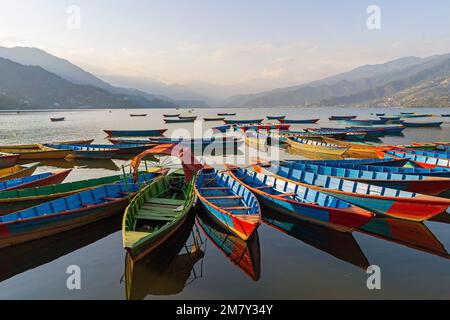 Pokhara, Nepal ; DEcember 4th, 2022; Multi coloured Boats in Phewa Lake Stock Photo