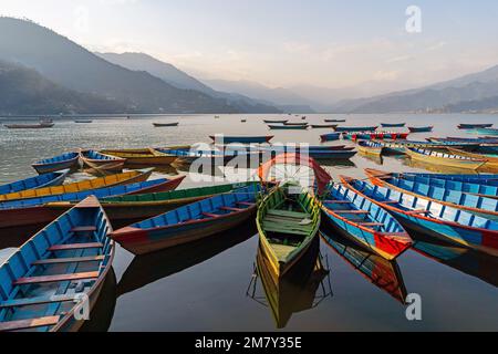 Pokhara, Nepal ; DEcember 4th, 2022; Multi coloured Boats in Phewa Lake Stock Photo