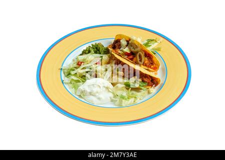 Beef tacos on plate with salad and avocado isolated on white with path Stock Photo