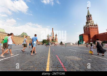 Moscow, Russia-July 20, 2010. Many tourists visit St. Basil's Cathedral on Red Square in Moscow, and taking pictures in front of the cathedral Stock Photo