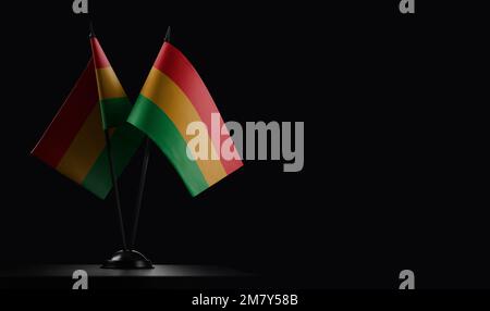 Small national flags of the Bolivia on a black background. Stock Photo