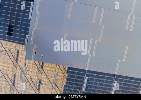 Steel framework for roof an under construction warehouse with metal trusses in building site Stock Photo