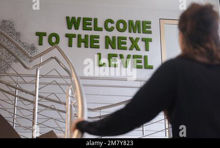 Zeitz, Germany. 11th Jan, 2023. 'Welcome Go the next Level' can be seen on the wall inside a coworking space. The industrial city is considered the heart of structural change in the Central German lignite mining region. Credit: Sebastian Willnow/dpa/Alamy Live News Stock Photo