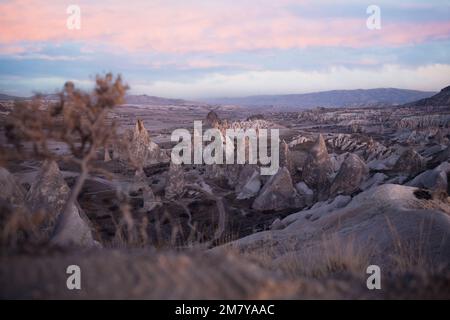 Stunning view of some rock formations in the Red & Rose Valley in Cappadocia during a beautiful sunrise. Goreme, central Anatolia, Turkey Stock Photo