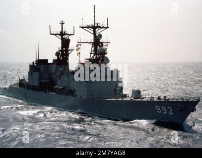 An aerial starboard bow view of the guided missile destroyer USS KIDD (DDG 993) underway. Country: Unknown Stock Photo