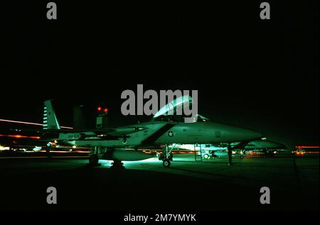 Nighttime view of an F-15 Eagle aircraft, assigned to the 48th Fighter Interceptor Squadron, on the flight line during Exercise Copper Flag. Subject Operation/Series: COPPER FLAG Base: Tyndall Air Force Base State: Florida (FL) Country: United States Of America (USA) Stock Photo